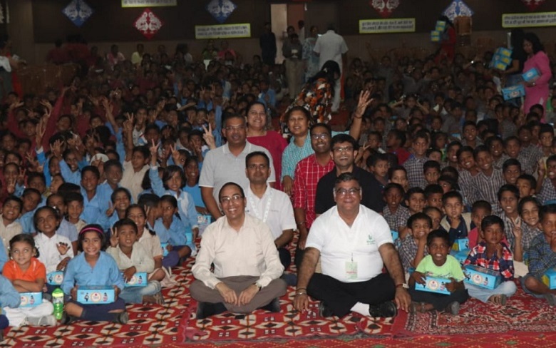 Underprivileged school children in India receive new shoes 