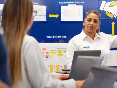 GKN employee in front of information.jpg