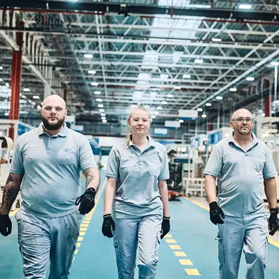 Three workers in warehouse
